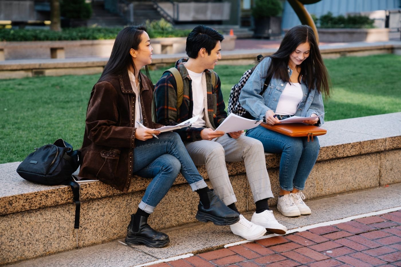 Students chatting on a campus bench