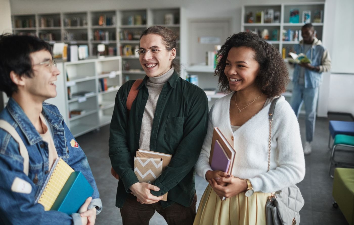 Students laughing in a library
