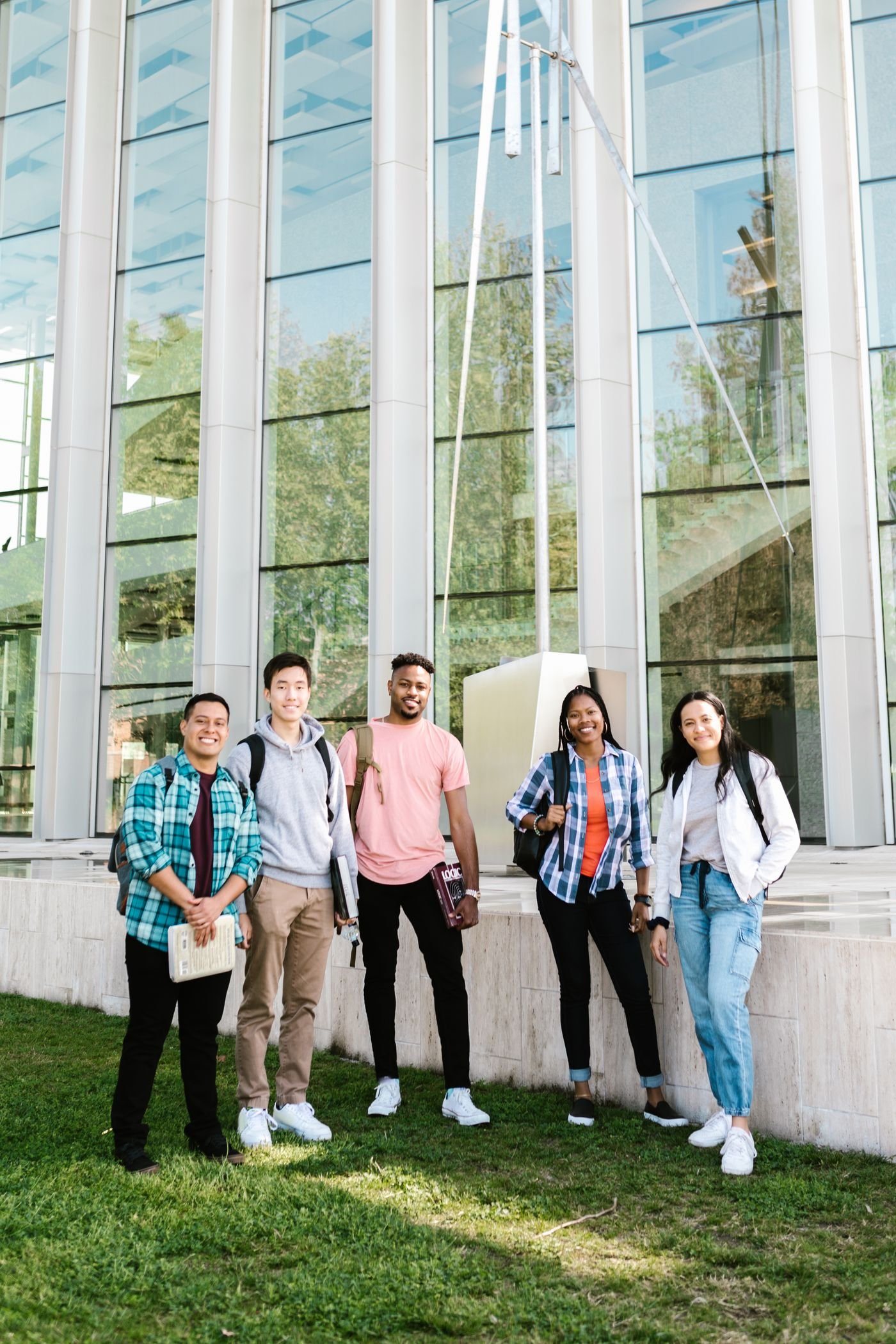 Students outside a modern campus building